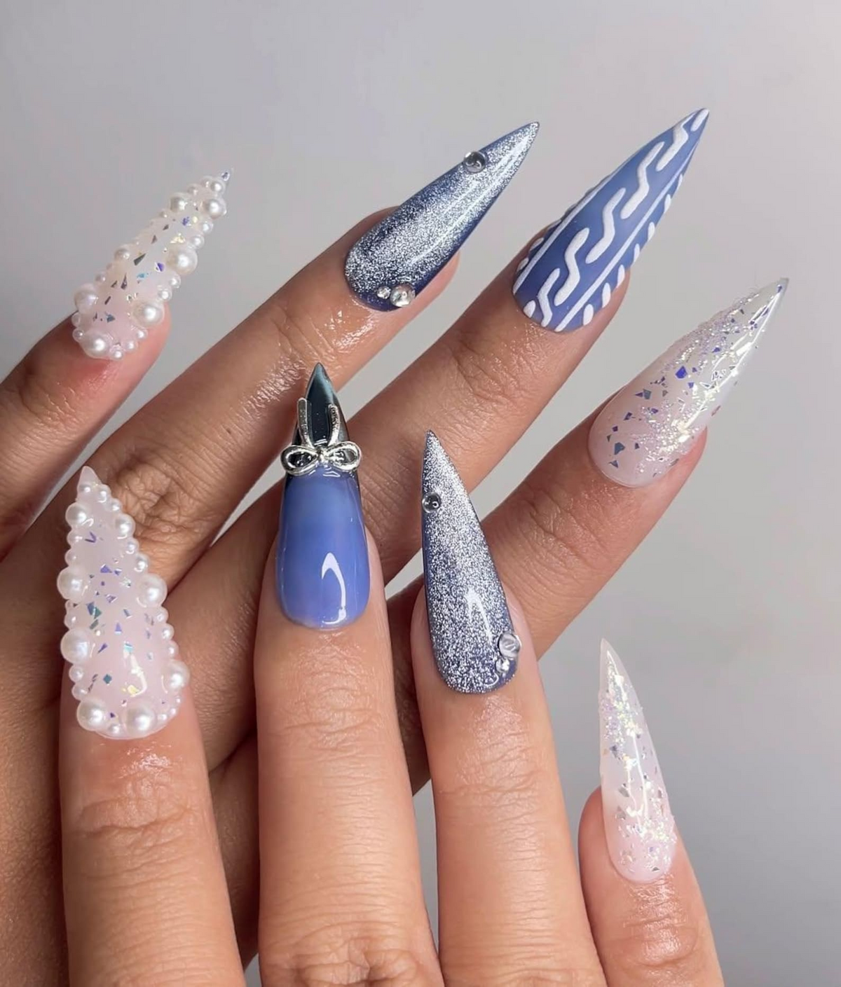 Frosted Winter Elegance Christmas Nails Icy Blue Chrome Nail Art Pearl Snowflake Design Winter Wonderland Nails Luxury Nail