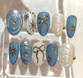 Blue Pearl Press On Nails – Shimmer Bow & Star Nail Art